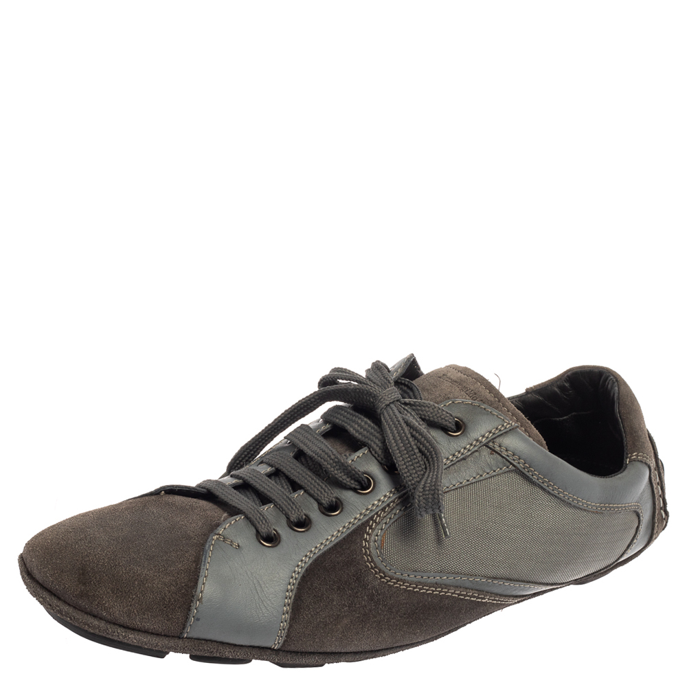 These fabulous sneakers from Ermenegildo Zegna are here to impress you with their effortless style The grey sneakers have been crafted from leather and suede and styled with round toes lace ups on the vamps and brand logo detailing on the tongues. They come equipped with comfortable leather insoles and durable rubber soles. Grab them right away