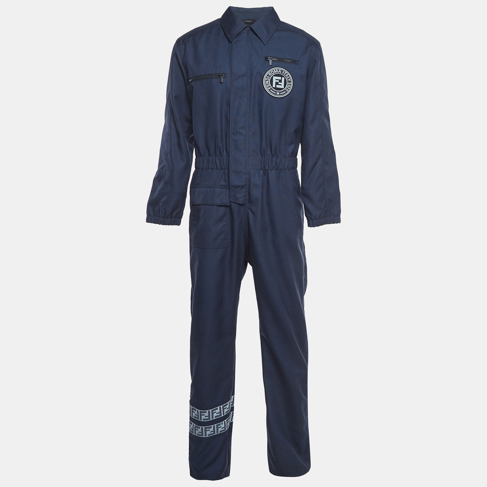 The Fendi jumpsuit is a sleek contemporary one piece garment crafted from high quality nylon. Featuring a tailored fit multiple utility pockets and the iconic Fendi logo it combines functionality with elevated style for a fashion forward statement.