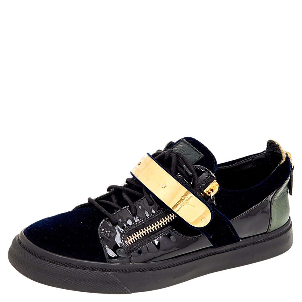 Bring home the luxurious high fashion touch with these sneakers from Giuseppe Zanotti. Crafted from prime quality materials these sneakers come flaunting suave details like the velcro straps the lace up and the zipper details. You wouldnt want to miss out on such a cool pair would you?