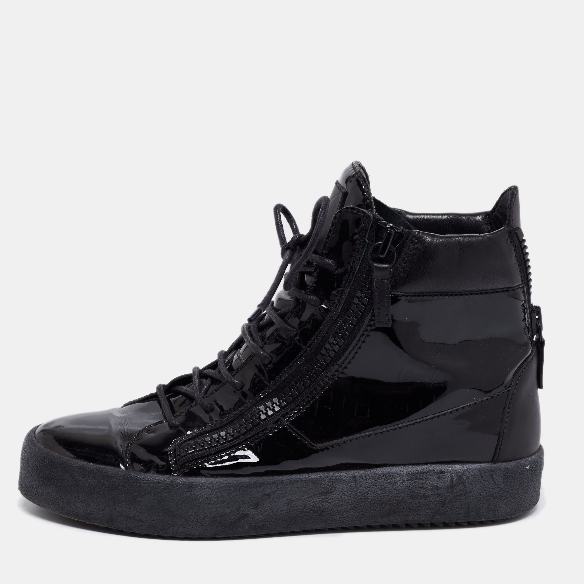 These Giuseppe Zanotti sneakers are meant to deliver a statement look. Crafted in Italy they are made of patent and leather and detailed with lace up fronts double zip detailing brand detail on the tongue leather lining and tonal rubber soles.