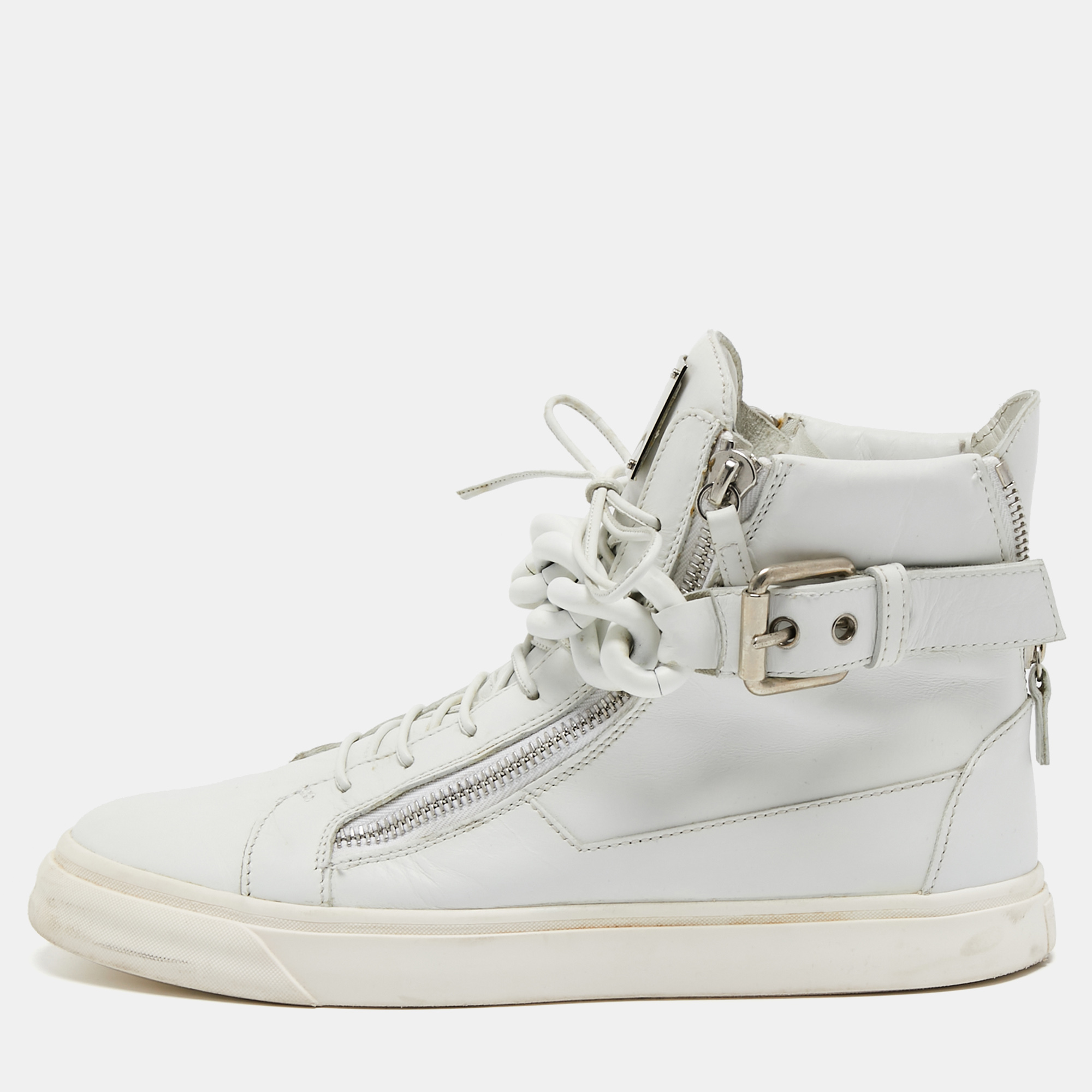 Giuseppe Zanotti brings you these sneakers that are super sturdy stunning and stylish. They are crafted from white leather into a classic high top silhouette. They are highlighted with zipper fastenings metal chain detailing and silver tone hardware. Add these trendy sneakers to your collection to sport a dapper look.