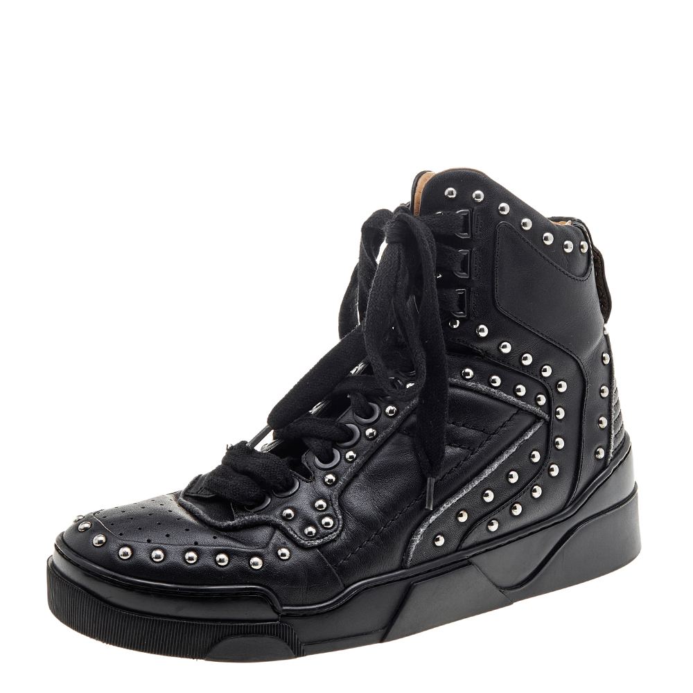 Give a fashionable update to your shoe collection with these high top sneakers from Givenchy. Crafted from leather these sneakers are added with lace ups silver tone studs and the signature on the heels. The pair is complete with comfortable leather insoles and flexible rubber outsoles.