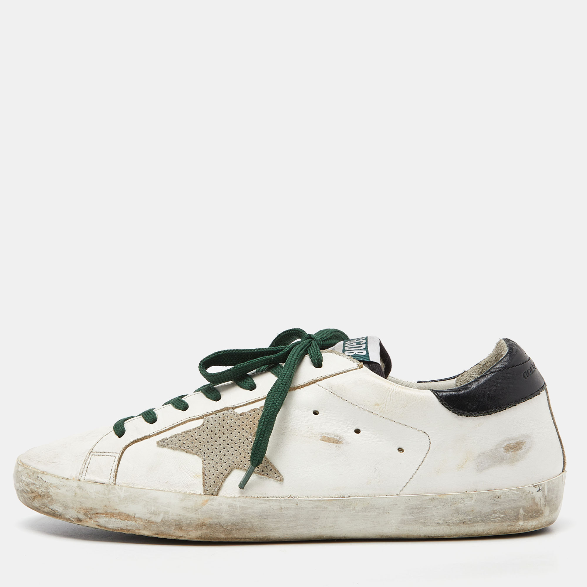 The white sneakers offer a wave of comfort. The Golden Goose sneakers have been crafted with suede as well as leather and they are easy to slip on. The trendy shoes feature star details lace ups and the comfortable insoles make them ideal to wear through all seasons.