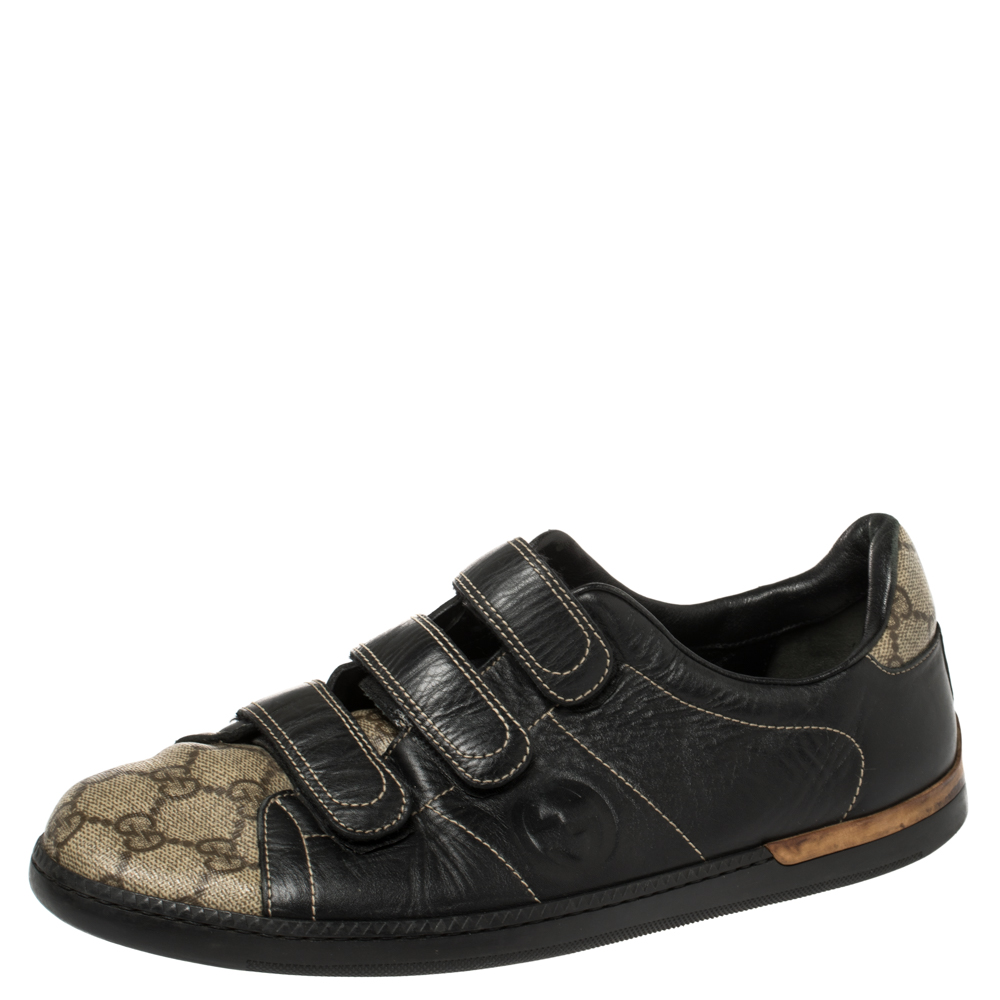 Feel great in your casual wear every time you step out in these sneakers from Gucci. Theyve been crafted from the signature GG Supreme canvas and leather and styled with triple velcro straps on the vamps. The black and beige sneakers are filled with comfort and effortless style.