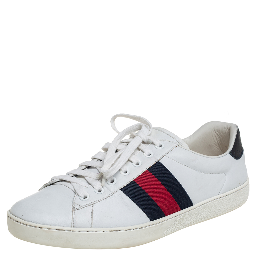 Stacked with signature details this Gucci pair is rendered in leather and is designed in a low cut style with lace up vamps. They have been fashioned with the iconic Web stripes for a signature touch. Complete with python embossed counters these shoes can be easily coordinated with your casuals.
