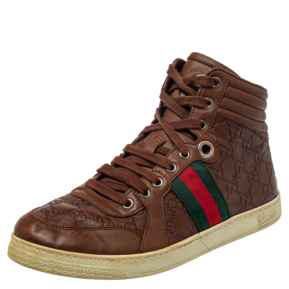 Flaunt a cool look with this pair of smartly crafted lace up sneakers by Gucci. Designed using Guccissima leather this pair of high top shoes are perfect for making a casual fashion statement that can make you the center of attention at all times.