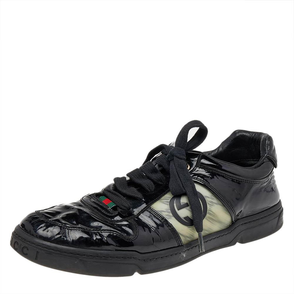 Adorned with signature details these Gucci sneakers are rendered in patent leather and are designed in a low cut style with lace up vamps and detailing of the iconic GG logo. The monochrome look ensures they are easily coordinated with your casuals heightening your closet and your look.