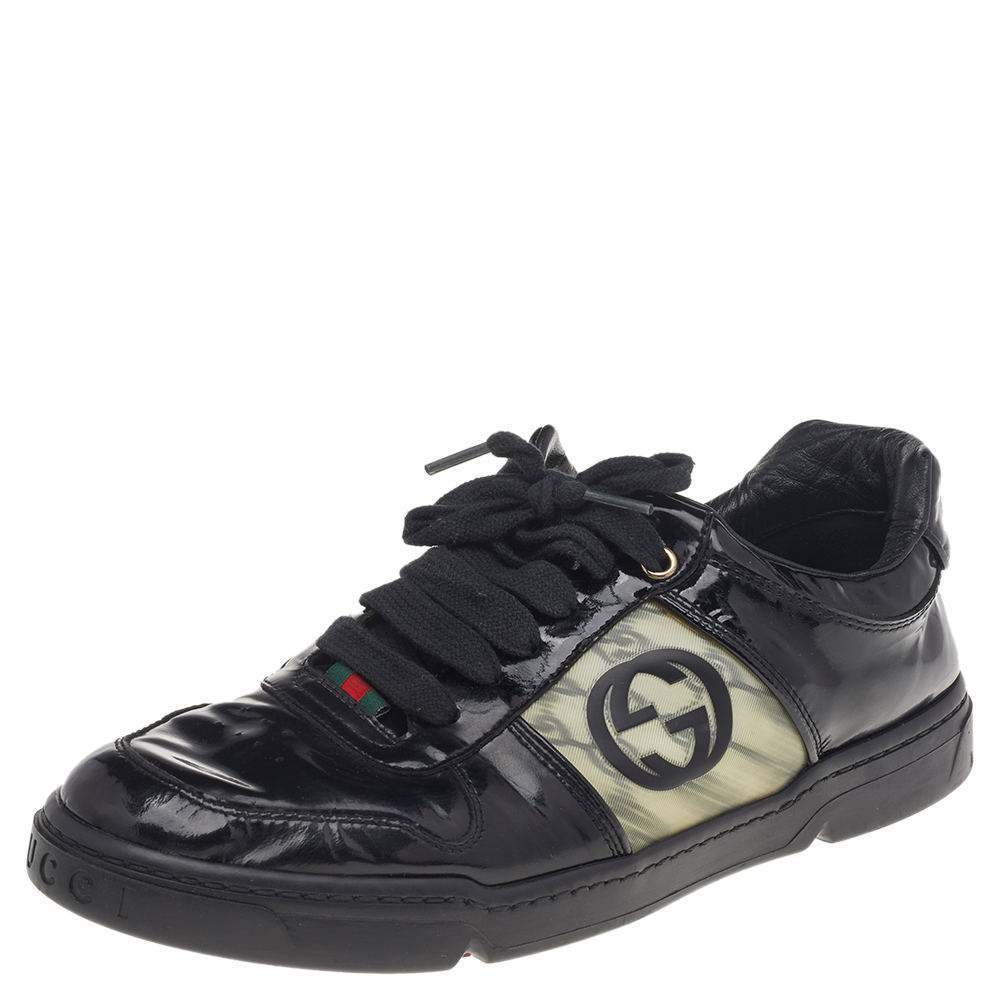 Fall in love with casual wear every time you step out in these sneakers from Gucci. Theyve been crafted from black patent leather and are styled with laces on the vamps along with the signature interlocking G logo on the quarters. The sneakers are filled with comfort and effortless style.