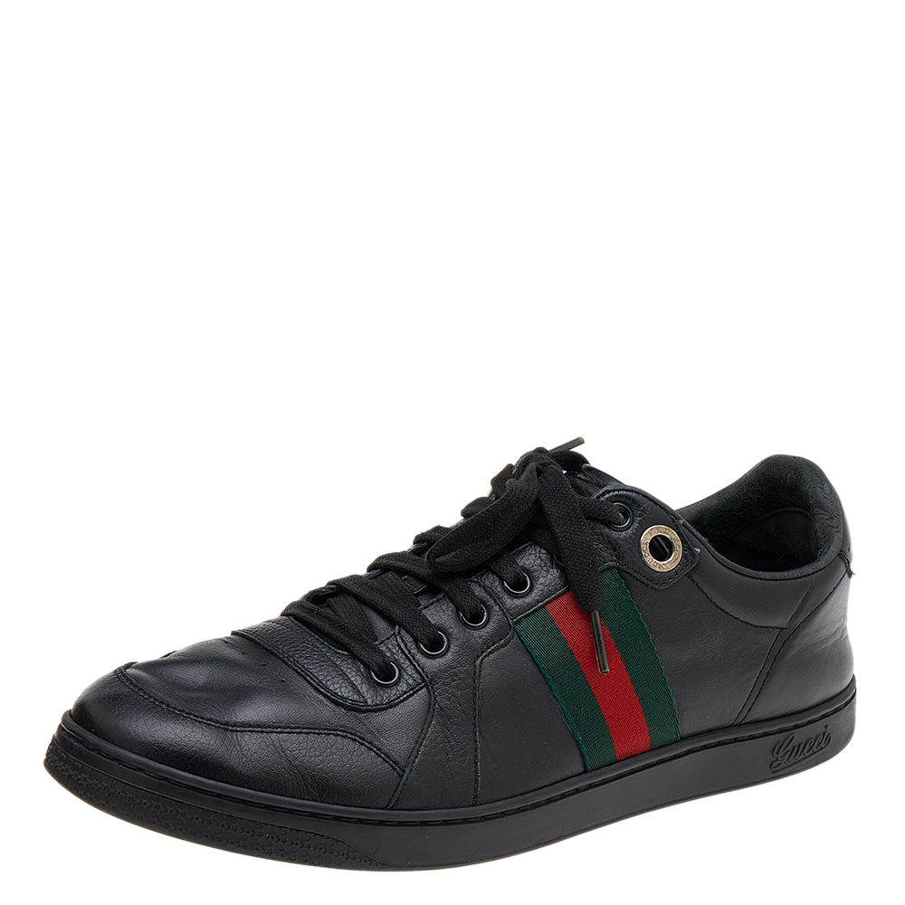 Stacked with signature details this Gucci pair is rendered in leather and is designed in a low cut style with lace up vamps. They have been fashioned with the iconic Web stripes and perforations. Complete with logo accented soles made from contrasting leather these shoes can be easily coordinated with your casuals.