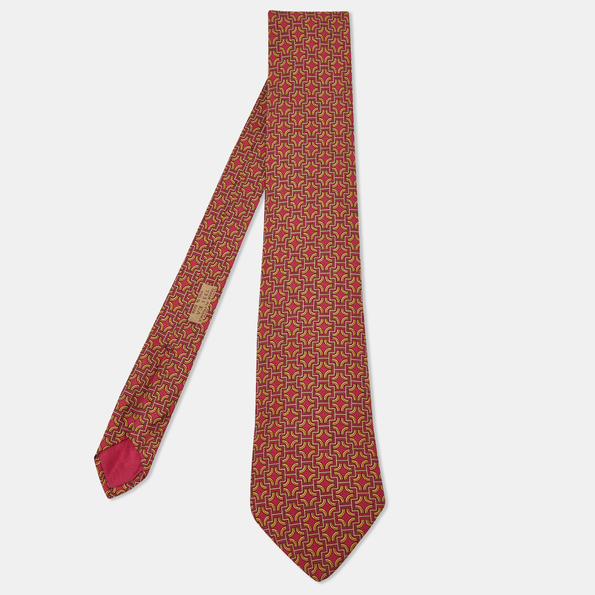 Made in France using 100% silk this Hermes tie for men has patterns printed all over. This finely tailored accessory will add a charming finish.