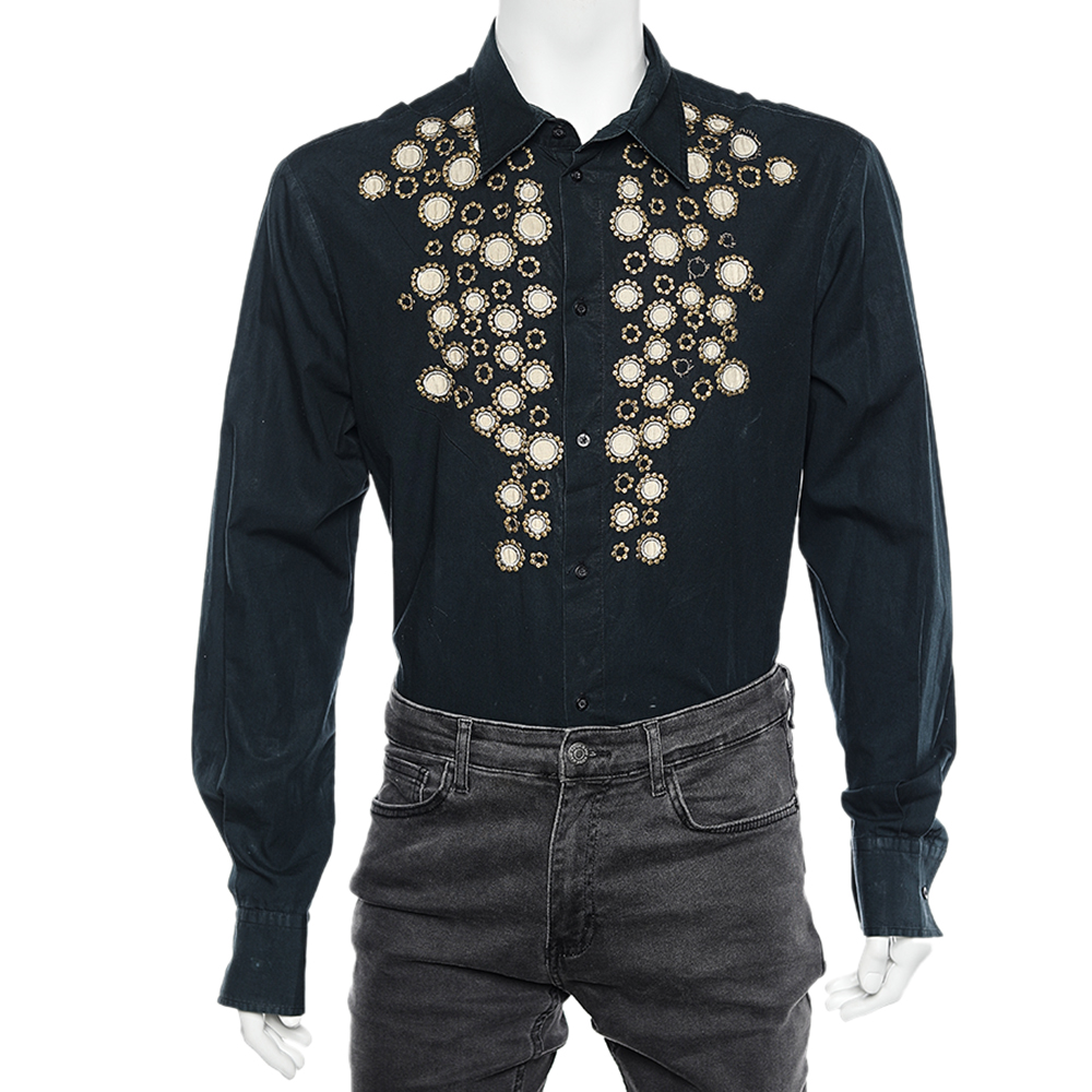 Look stylish and suave in this black embellished shirt from Just Cavalli. Crafted from cotton it is a comfortable yet perfect piece for casual dinner outings. Pair with fitted trousers for a fashionable look.