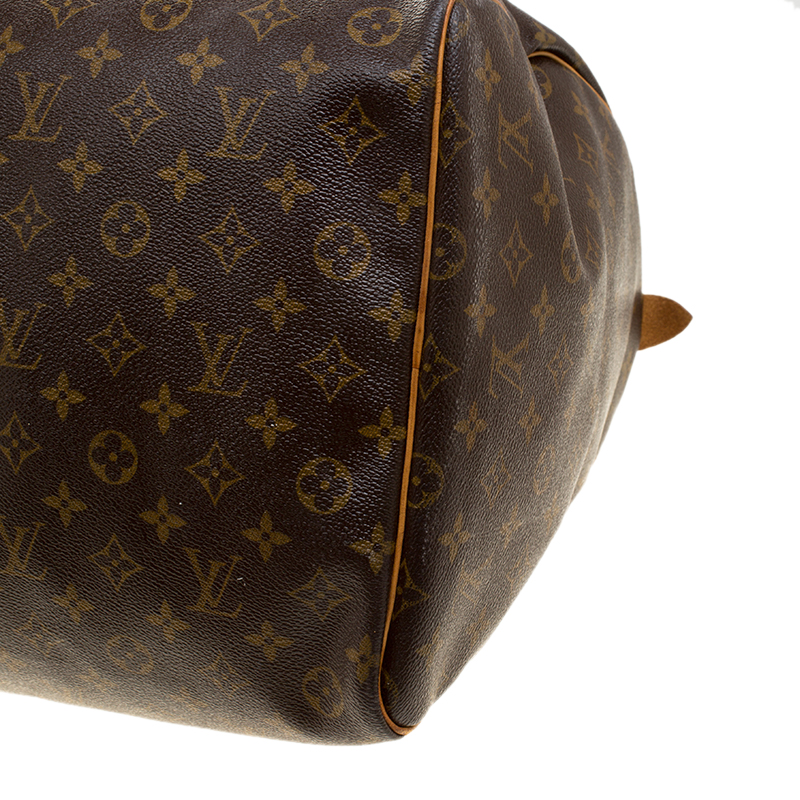 LOUIS VUITTON. Keepall 60 bag in monogram canvas and nat…