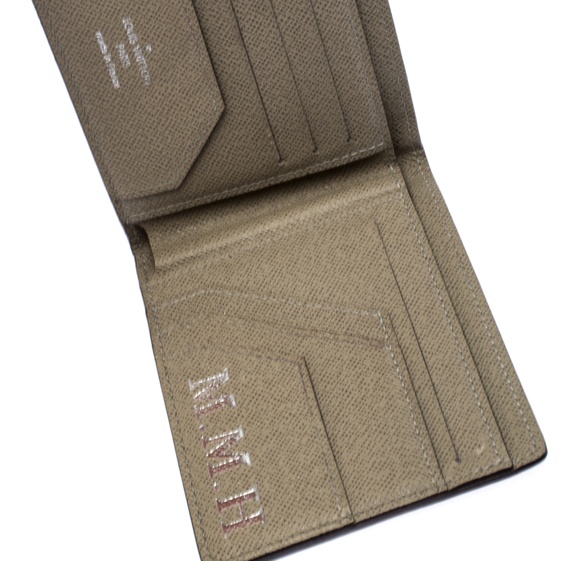 

Louis Vuitton Beige Tiaga Leather Bifold Wallet