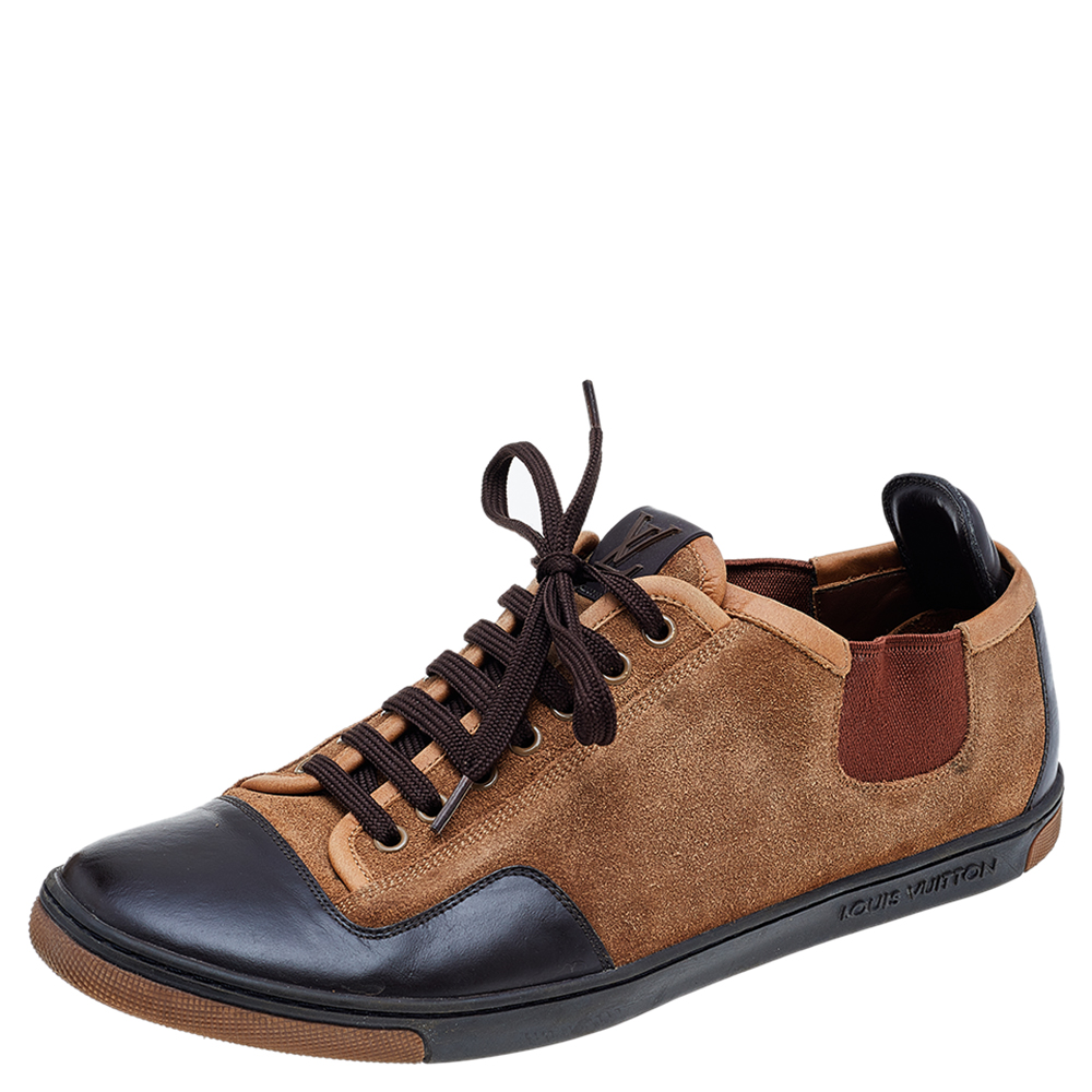 Enjoy footwear ease with this pair of low top sneakers by Louis Vuitton. The shoes have been crafted from suede as well as leather and designed with lace up on the vamps. The leather insoles add to the comfort of the pair.