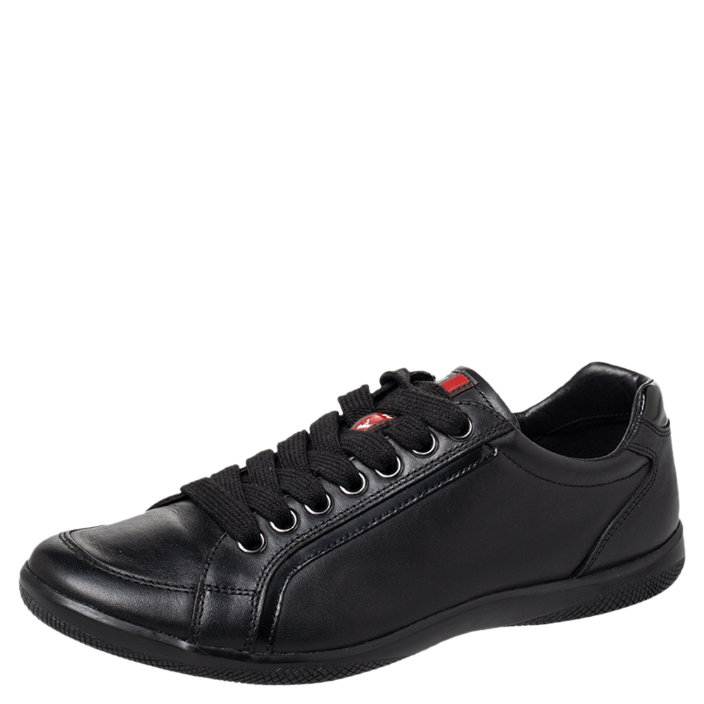 Coming with a classic low top silhouette these Prada Sport sneakers are a seamless combination of luxury comfort and style. They are made from leather in a black shade. These sneakers are designed with the labels name on the tongues laced up vamps and comfortable insoles.