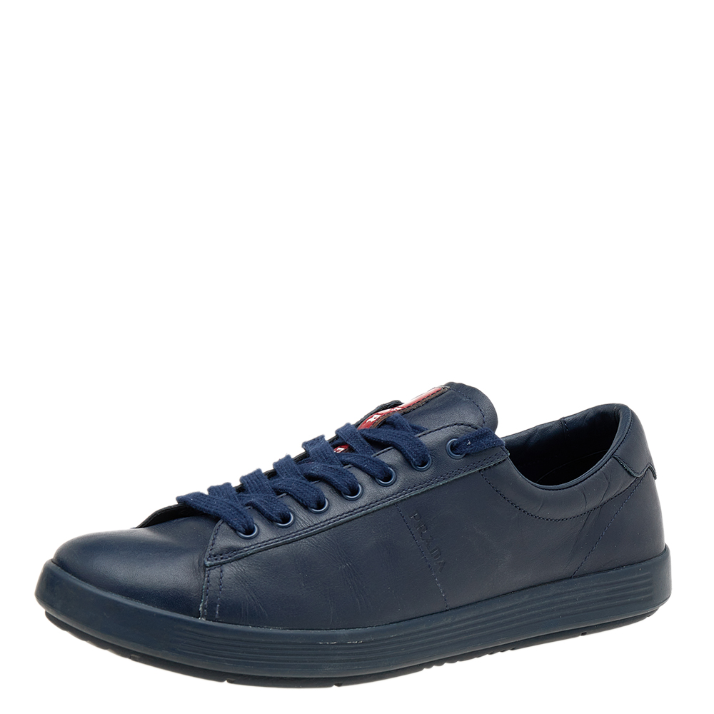Meticulously crafted using leather these Prada Sport sneakers are recognized for their sleek and simple design. Clean cut and built for comfort this pair of blue shoes feature lace up vamps and matching blue tone hardware. Wear them with your casual outfits and look effortlessly cool.