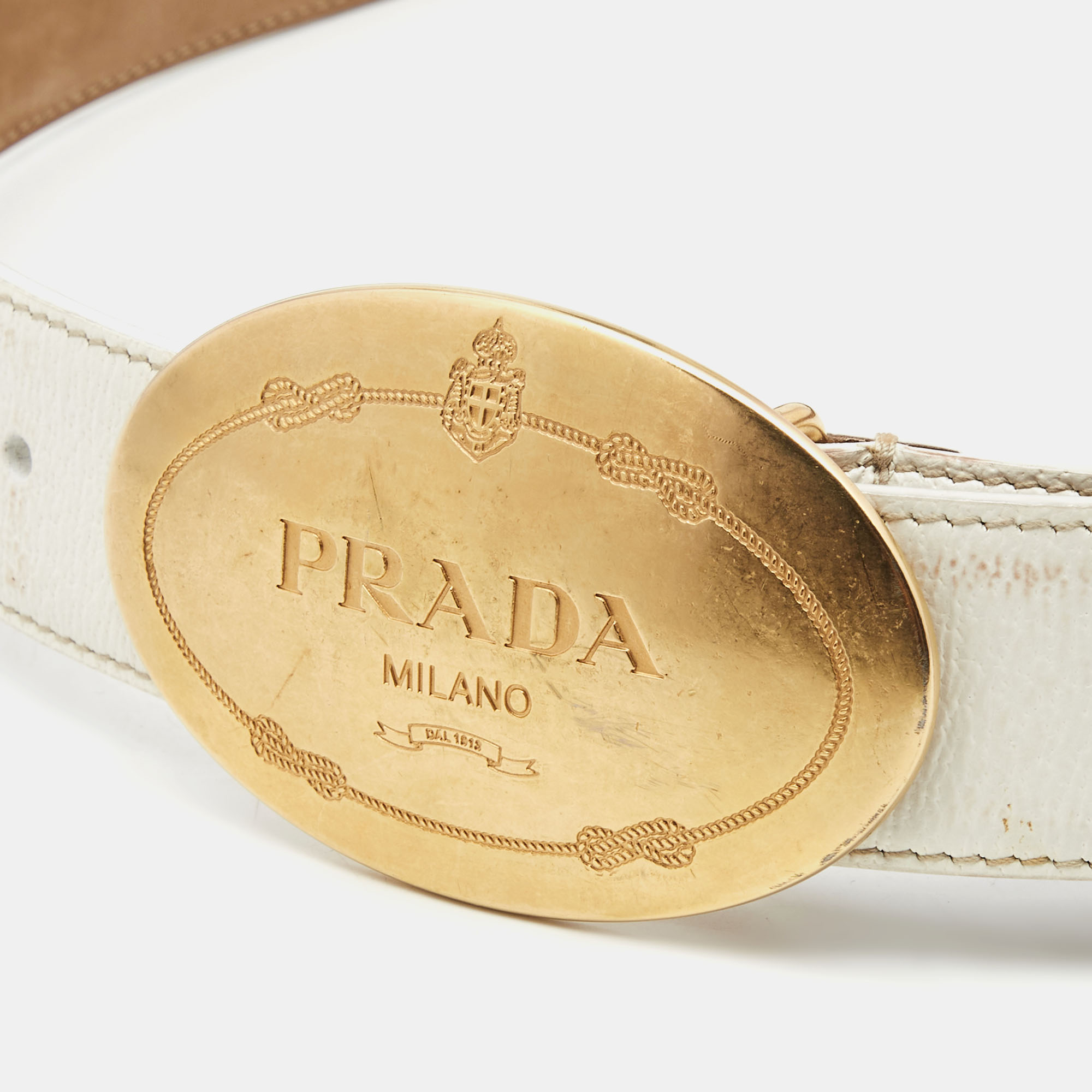 

Prada White Leather Engraved Oval Plaque Buckle Belt