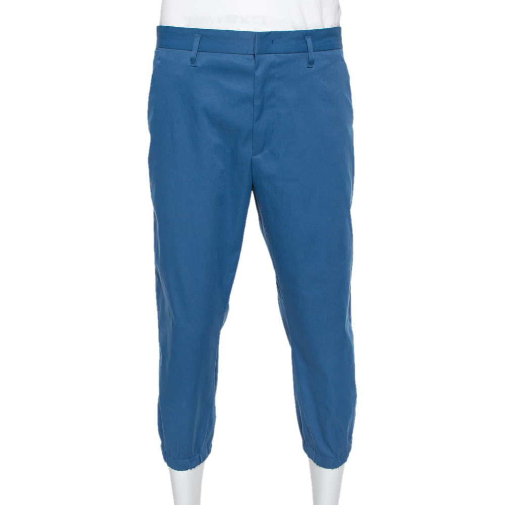 Get comfortable in true Prada style with these blue capri pants for men. Tailored using quality fabrics the pair features front zip button closure belt loops on the waistband and pockets on the sides as well as at the back.
