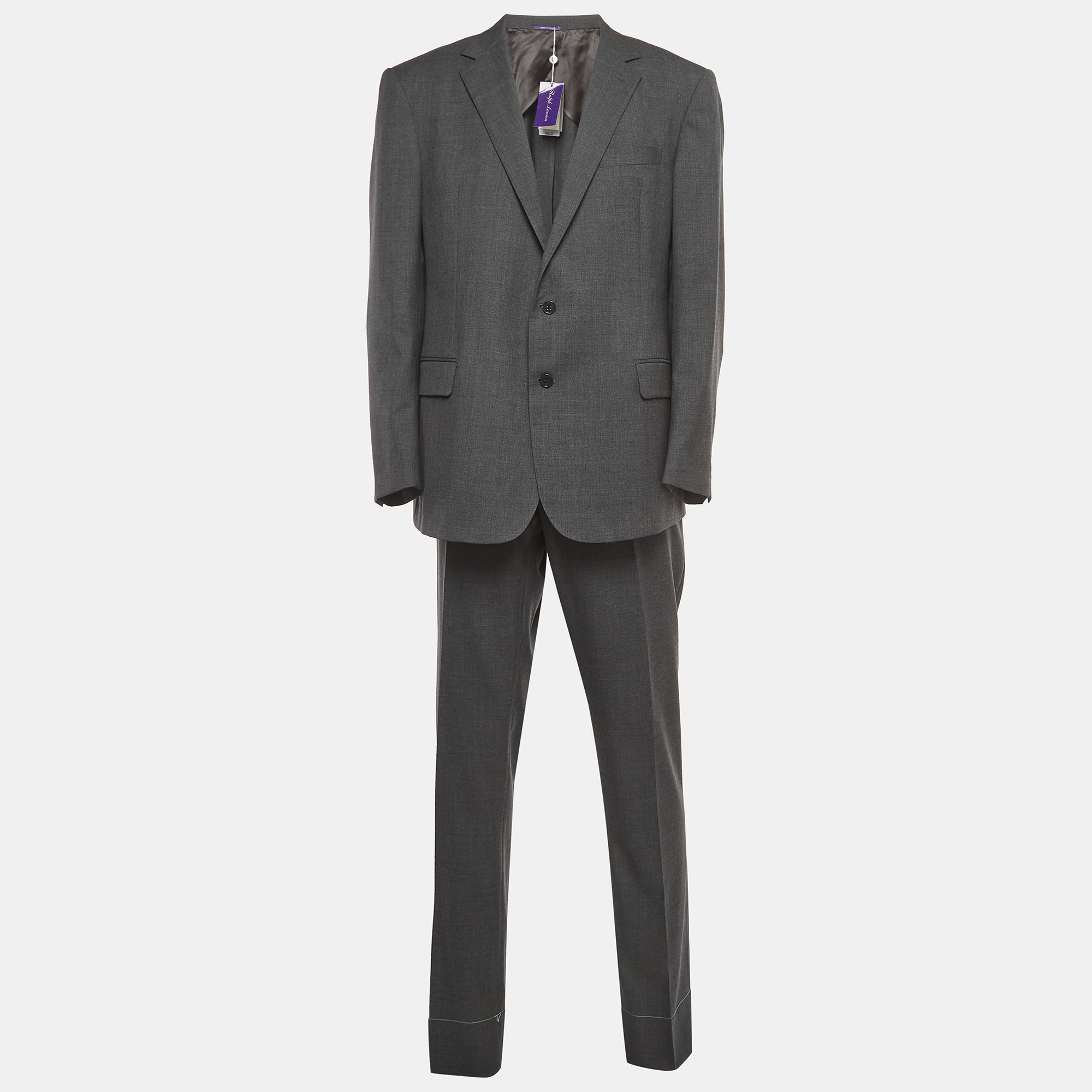 The Ralph Lauren RLX Pants Suit exudes sophistication and modern style. Crafted from high quality wool the sharkskin pattern adds a subtle texture. The blazer features a tailored fit while the pants showcase a classic silhouette. This ensemble effortlessly combines elegance with a contemporary edge.