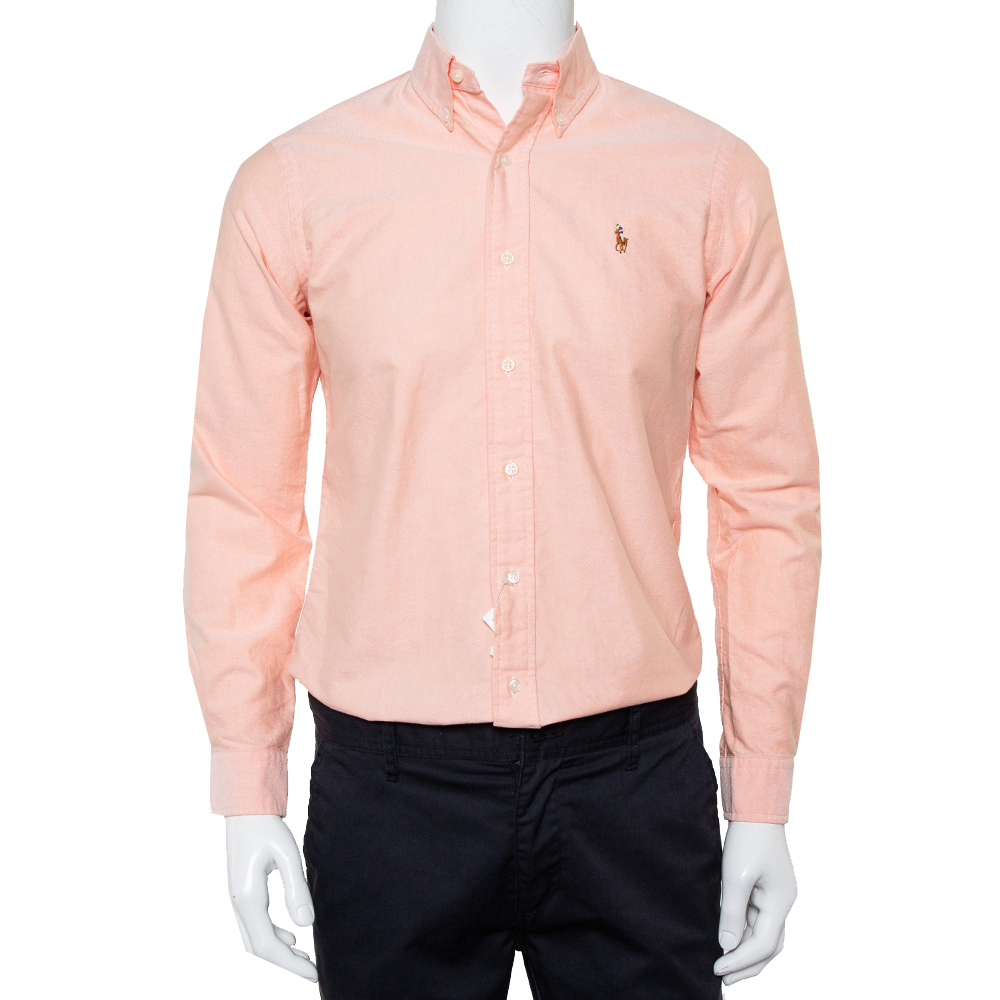 Set style goals for everyone by adorning this stunning custom fit shirt from the house of Ralph Lauren. Look smart in this creation that comes in a pink shade. Tailored from cotton it is styled with a collar long cuffed sleeves button front and logo detailing on the front.