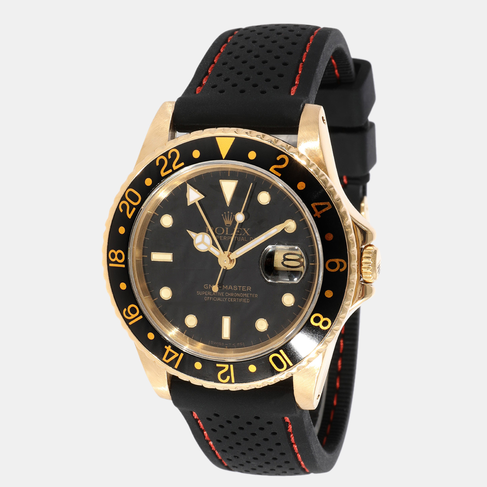 Spruce up your evening ensembles with this gorgeous Rolex wristwatch. The watch boasts a black dial featuring a date window and luminous markers with an 18K yellow gold case and a unidirectional rotatable 60 minute graduated black enamel bezel. It is secured by an 18K yellow gold Jubilee bracelet.