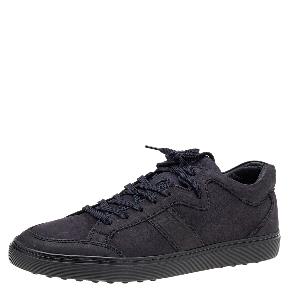 Coming in a classic low top silhouette these Tods sneakers are a seamless combination of luxury comfort and style. They are made from leather in a midnight blue shade. These sneakers are designed with logo details laced up vamps and comfortable insoles.