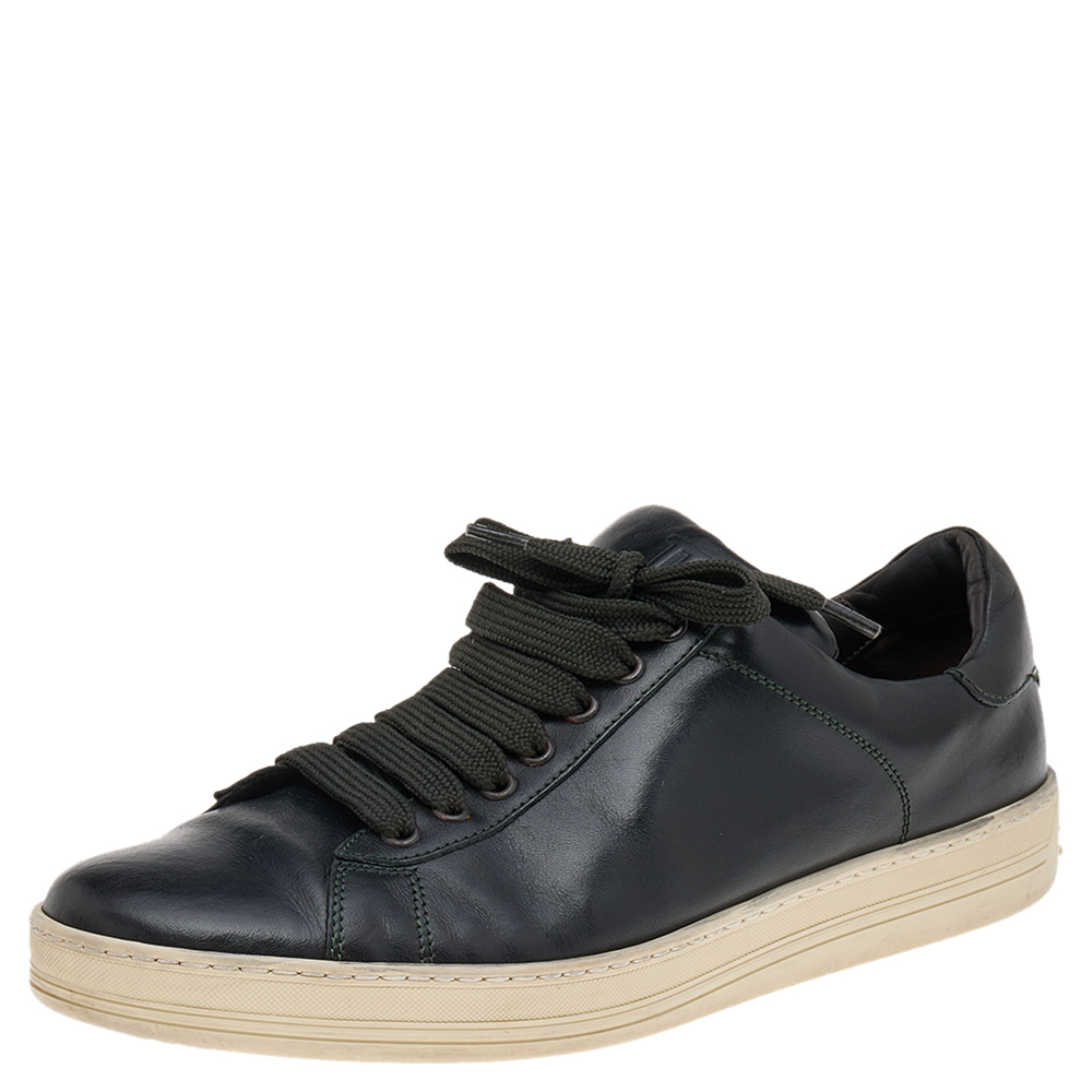 Coming in a classic low top silhouette these Tom Ford sneakers are a seamless combination of luxury comfort and style. They are made from leather in a black shade. These sneakers are designed with logo details laced up vamps and comfortable insoles.