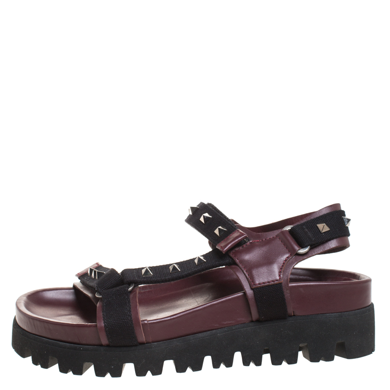

Valentino Burgundy Leather And Black Canvas Rockstud Flat Sandals Size