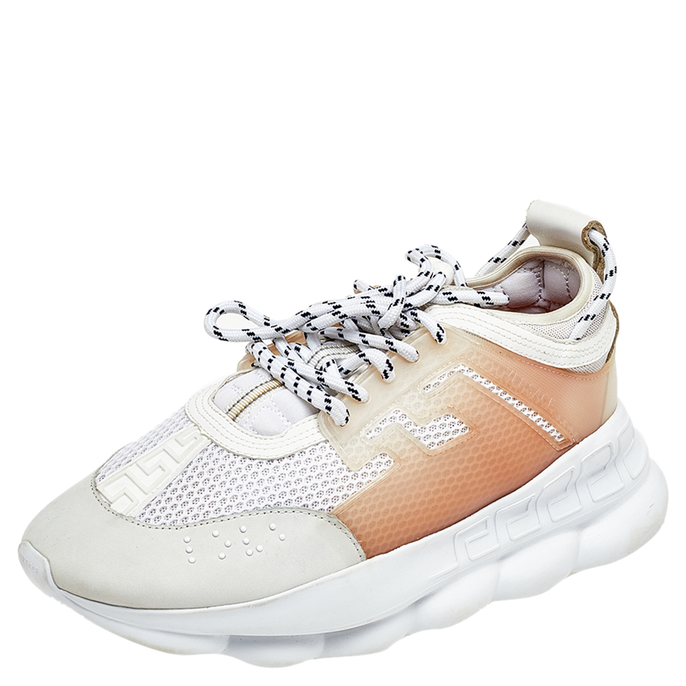 Versaces Chain Reaction sneakers are for fashionable people like you. These ones are crafted from high grade materials in white and grey. They feature laces signature detailing high platforms and outsoles featuring a chain like design.