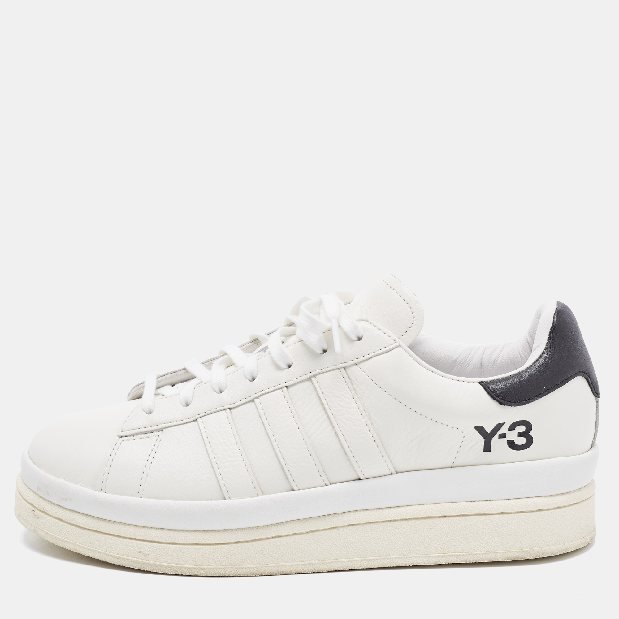Y 3 brings you these super stylish sneakers to elevate your appearance They are crafted using black white leather into a sturdy low top silhouette. They exhibit lace up fastenings on top and brand detail on their sides.