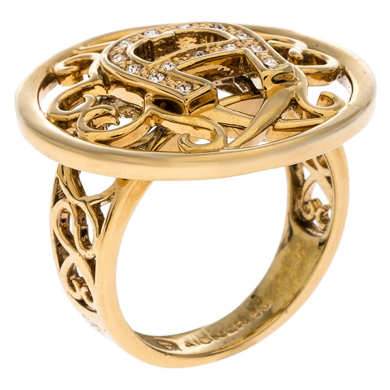 Aigner Gold Tone Crystal Embellished Logo Ring Size 56