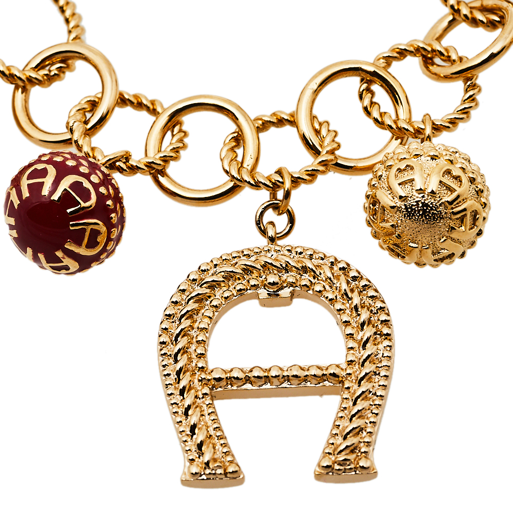 

Aigner Crystal Gold Tone Charm Bracelet