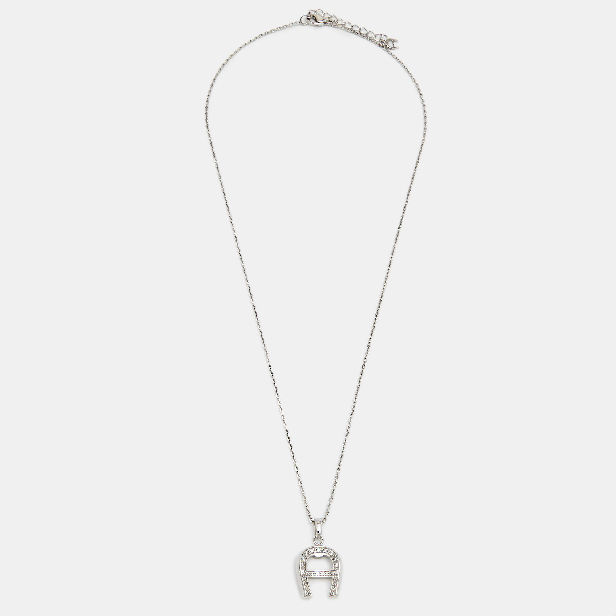 

Aigner Silver Tone Crystal Logo Pendant Necklace & Earrings Set