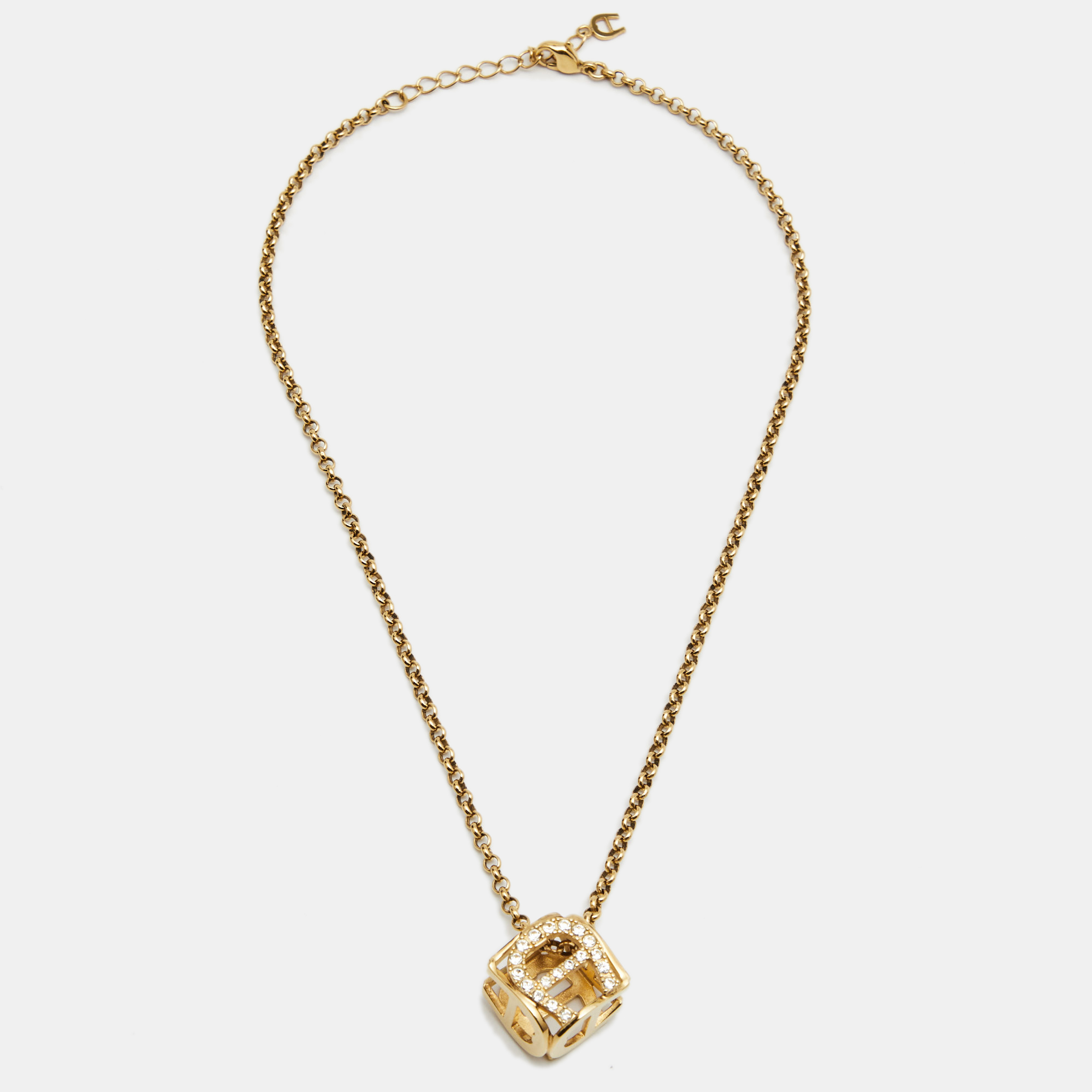 

Aigner Gold Tone Crystal Cube Pendant Necklace
