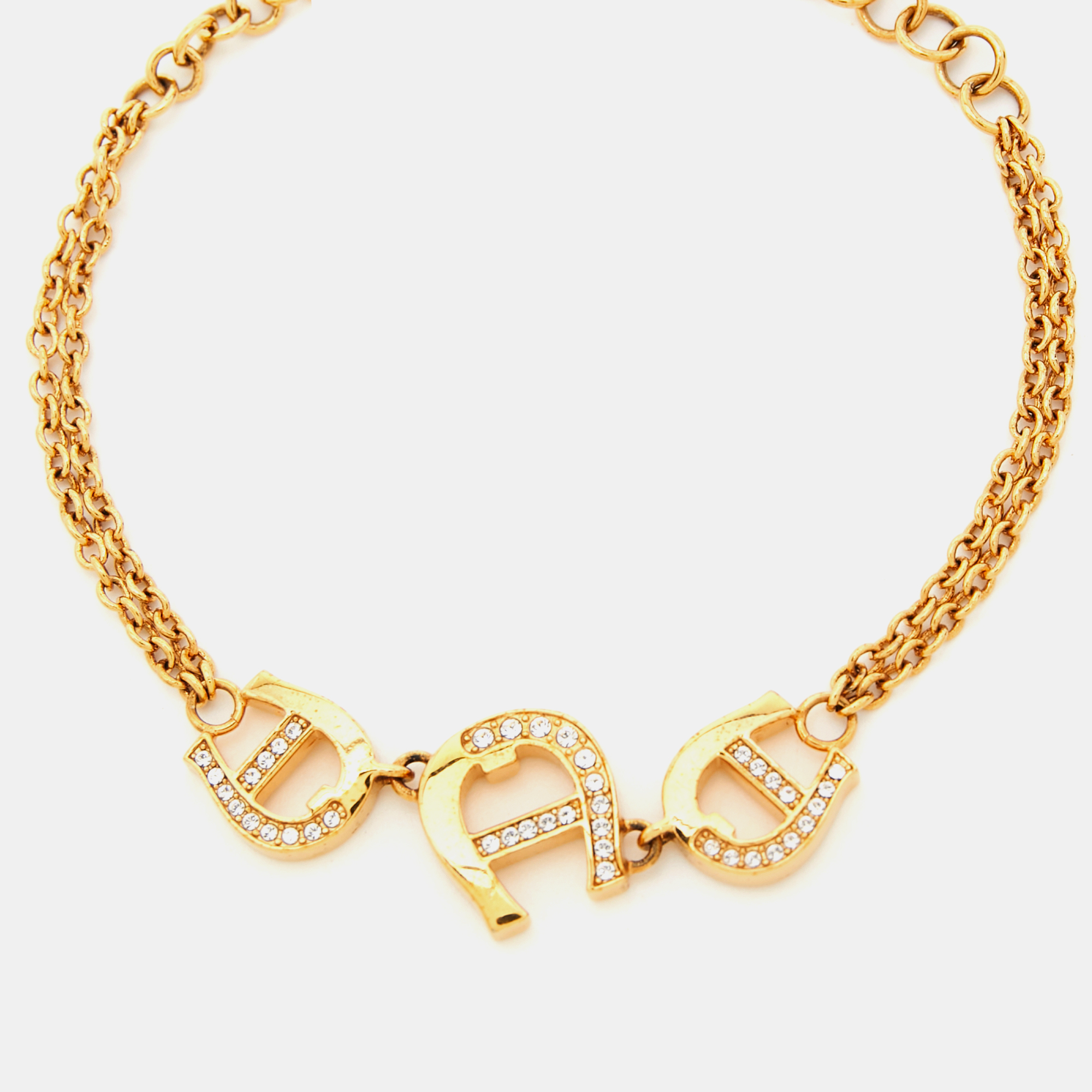 

Aigner Gold Tone Crystal Logo Chain Bracelet