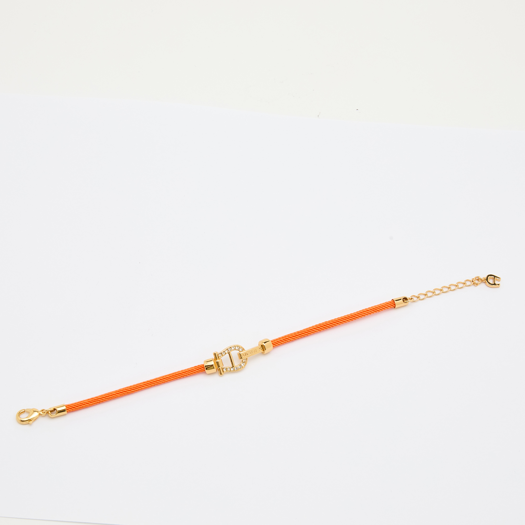 

Aigner Orange Silk Cord Crystal Logo Yael Bracelet