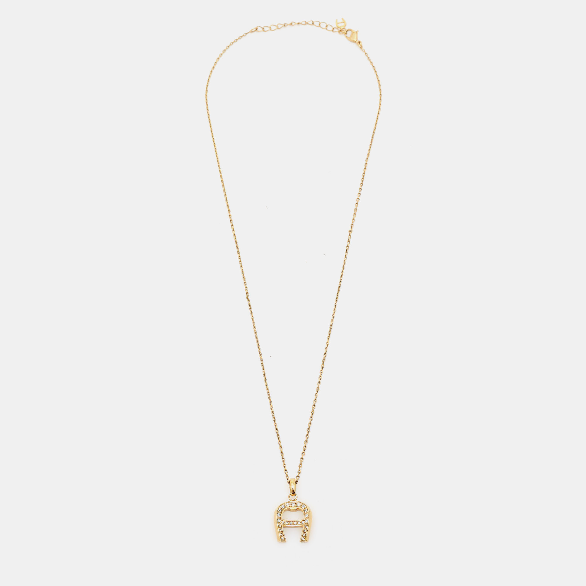 

Aigner Crystal Gold Tone Pendant Necklace