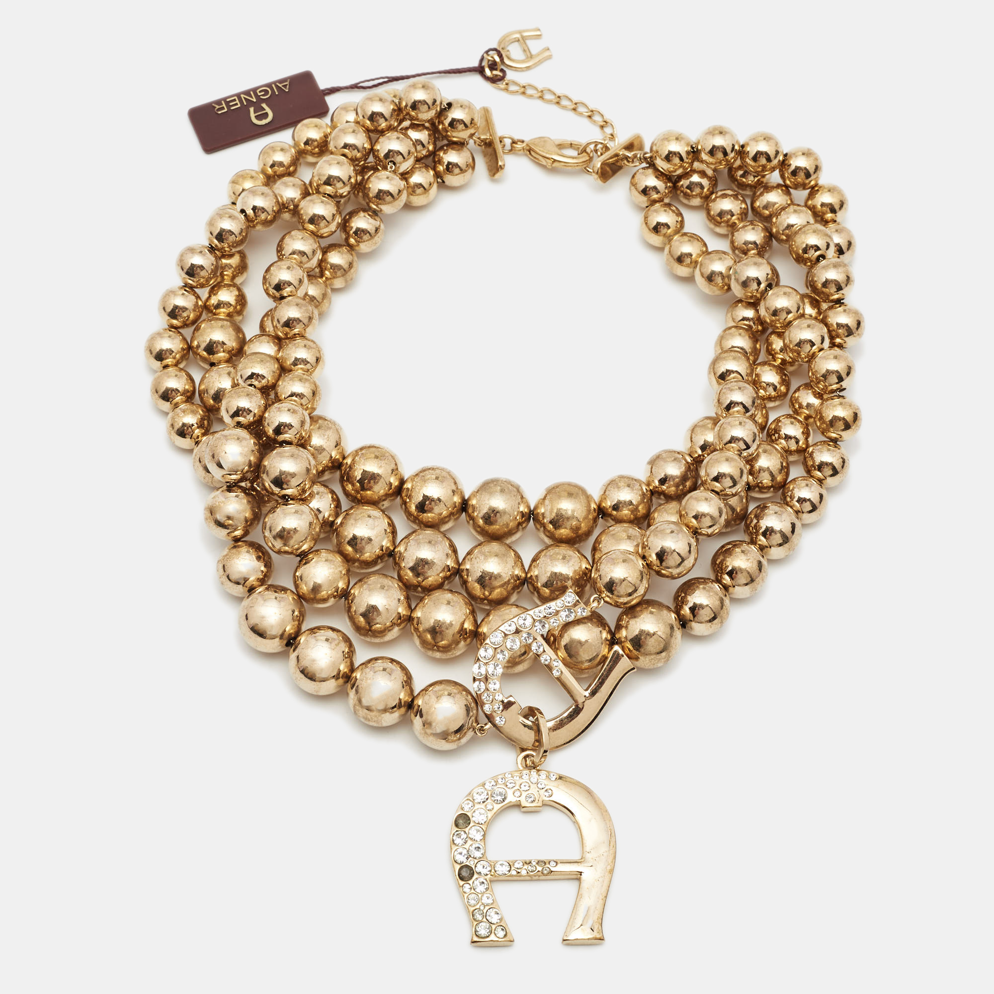 

Aigner Bedazzled Crystal Gold Tone Multistrand Necklace