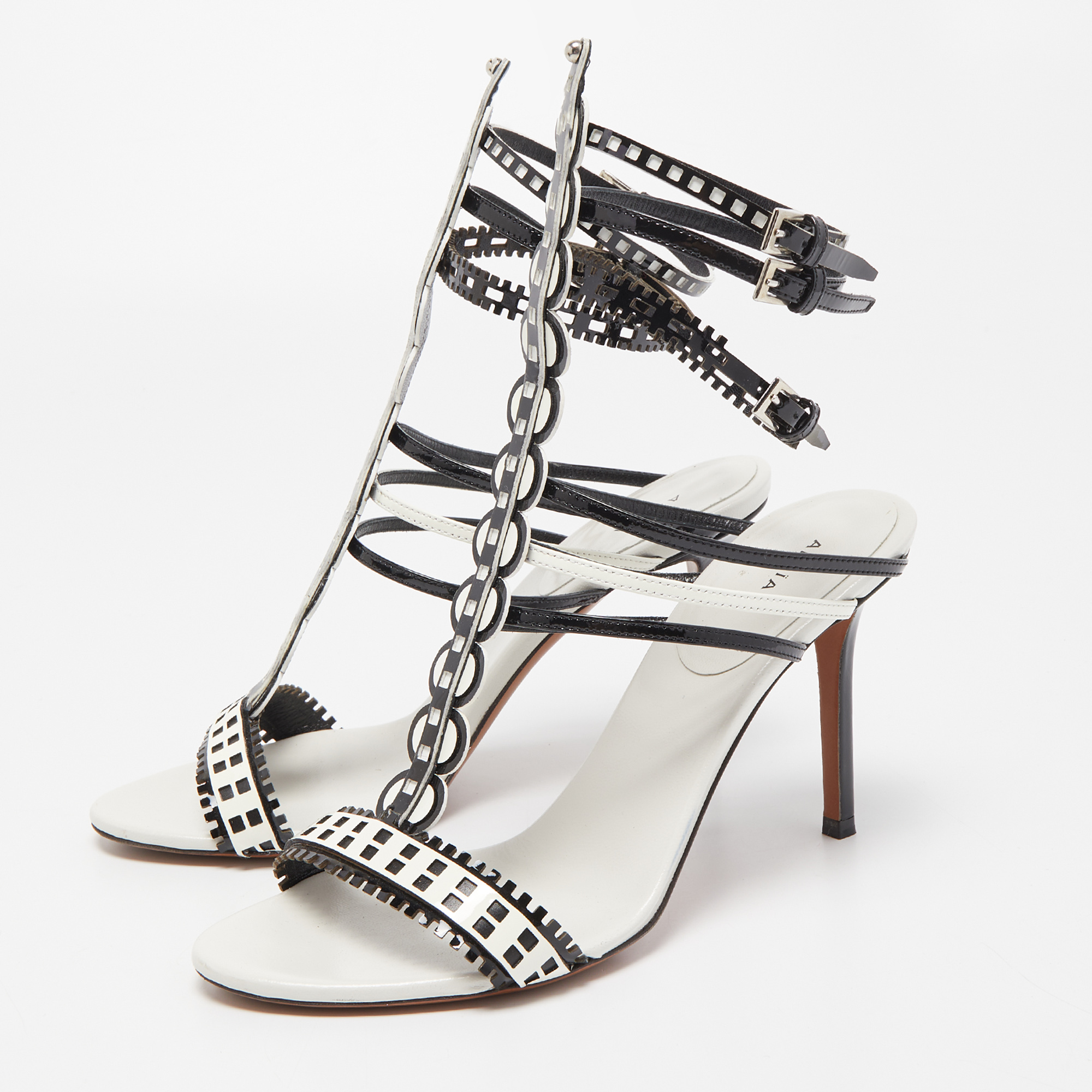 

Alaia White/Black Laser Cut Patent Leather Strappy Sandals Size