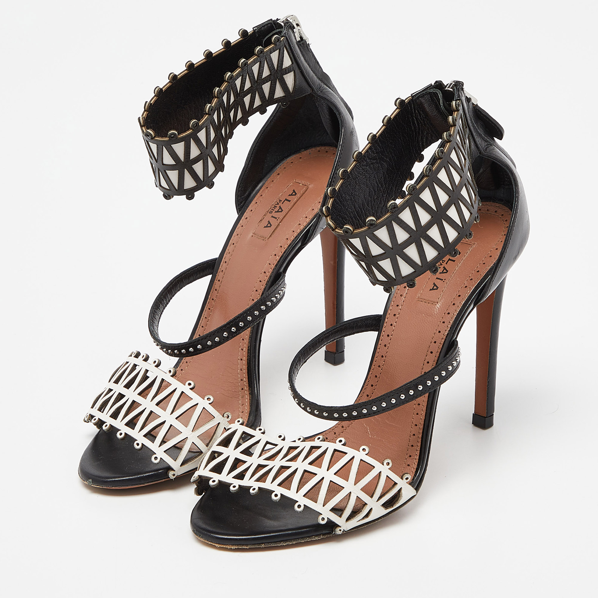 

Alaia Black/White Laser Cut Leather Studded Ankle-Strap Sandals Size