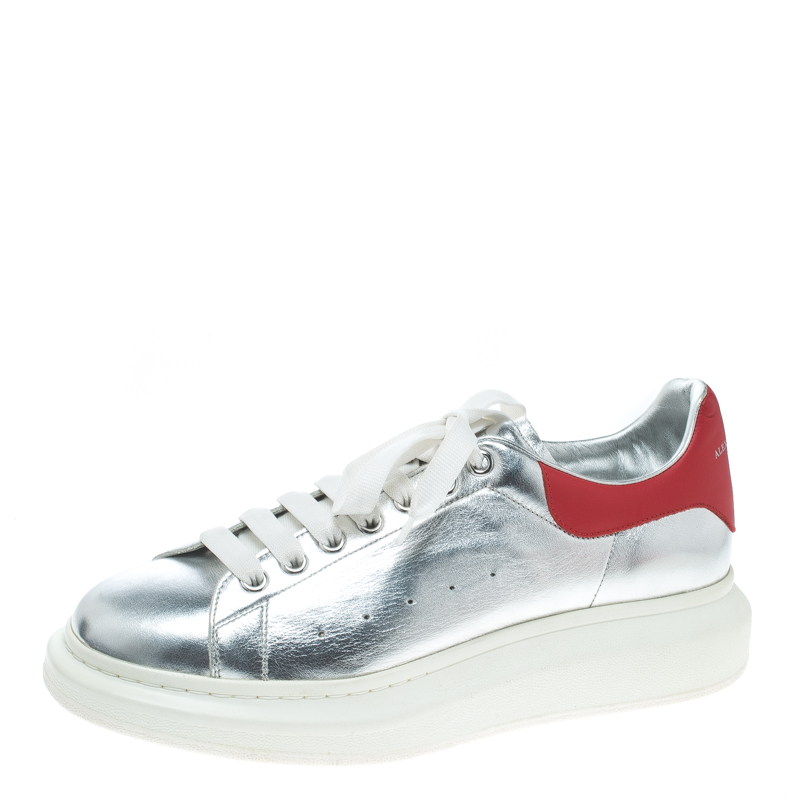 silver and red sneakers