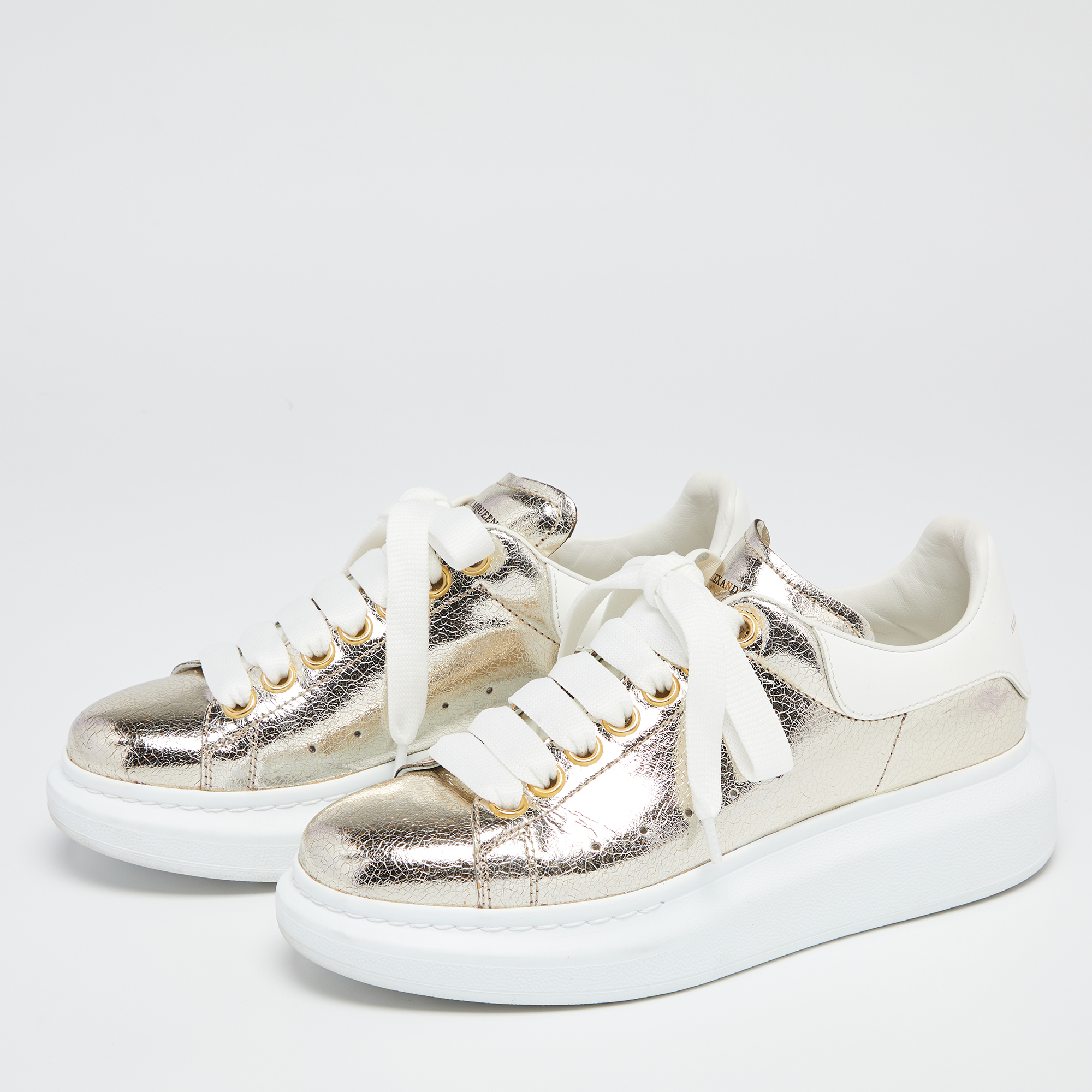 

Alexander McQueen White/Gold Leather Oversized Sneakers Size