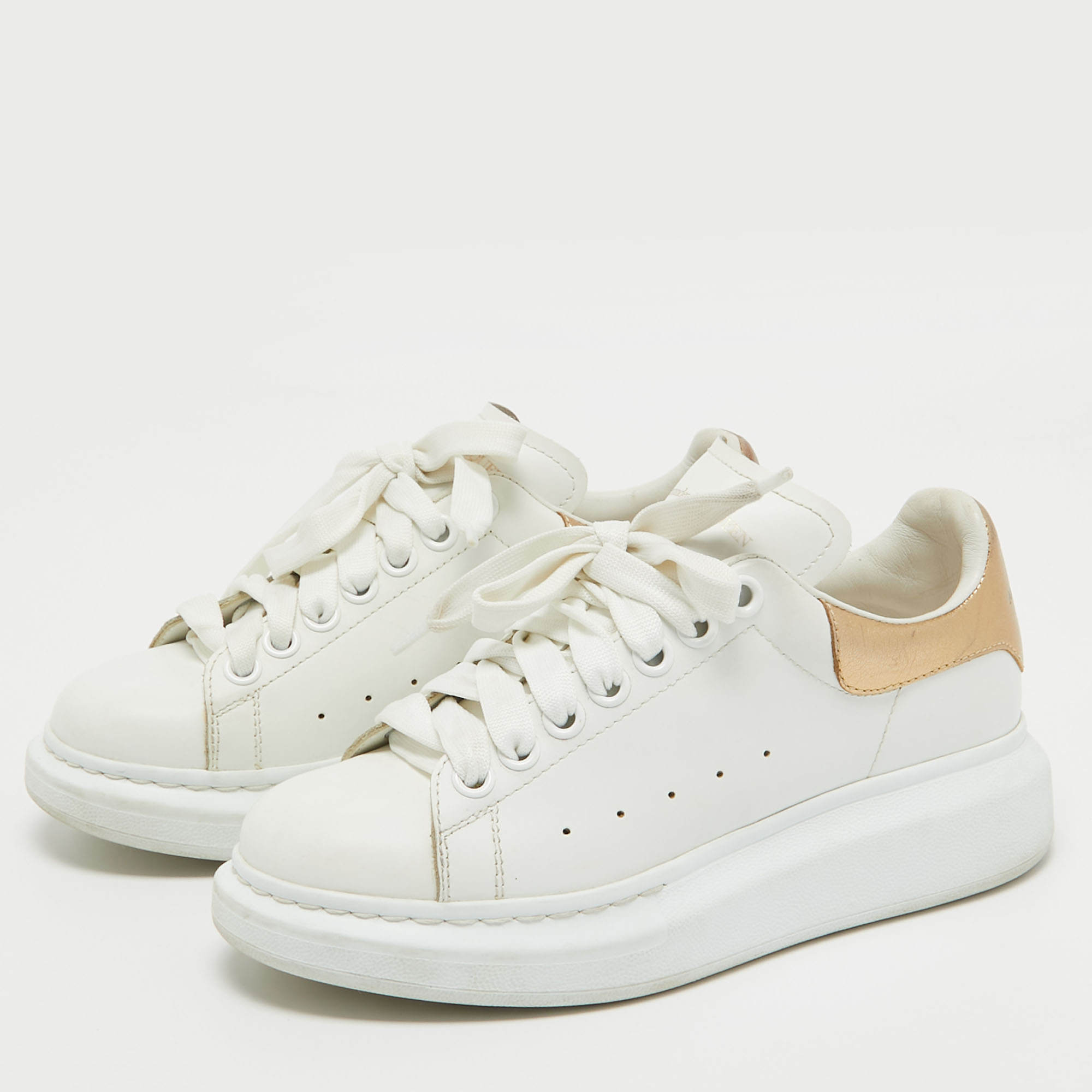 

Alexander McQueen White/Gold Leather Oversized Sneakers Size