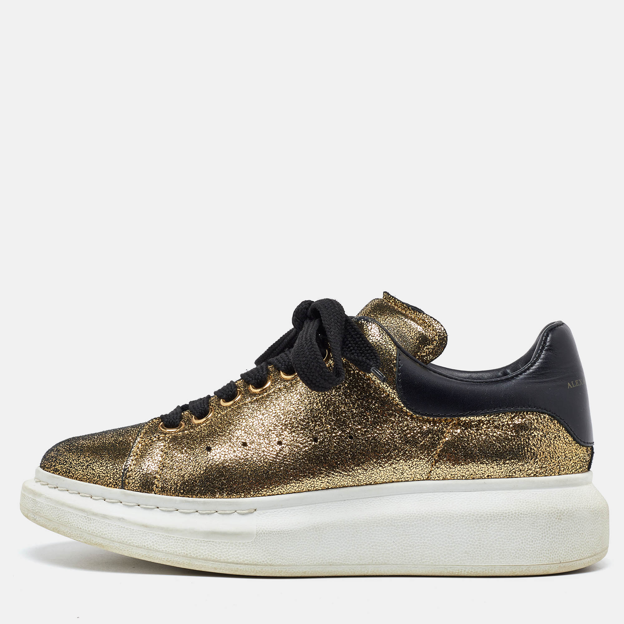 

Alexander McQueen Gold/Black Foil Leather Oversized Low Top Sneakers Size