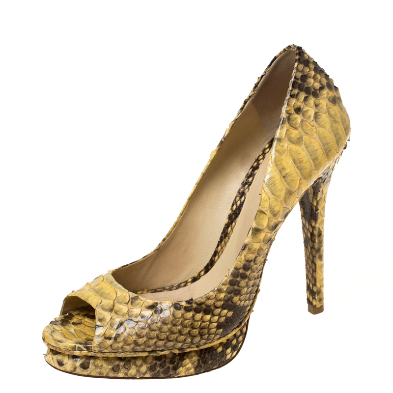 Perfect to compliment any outfit these yellow pumps from Alexander Birman are worthy of being a part of your closet. They have been crafted from python leather and styled with peep toes. They come equipped with comfortable leather lined insoles and 13.5 cm stiletto heels. Grab them right away