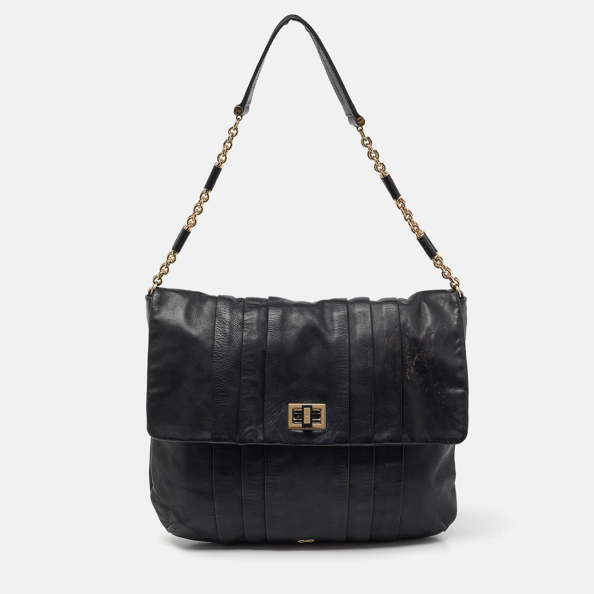 Elevate your style with this gorgeous hobo by Anya Hindmarch. Crafted from black leather the bag features gold tone hardware the logo on the flap and a well sized fabric interior. It is complete with a single handle.