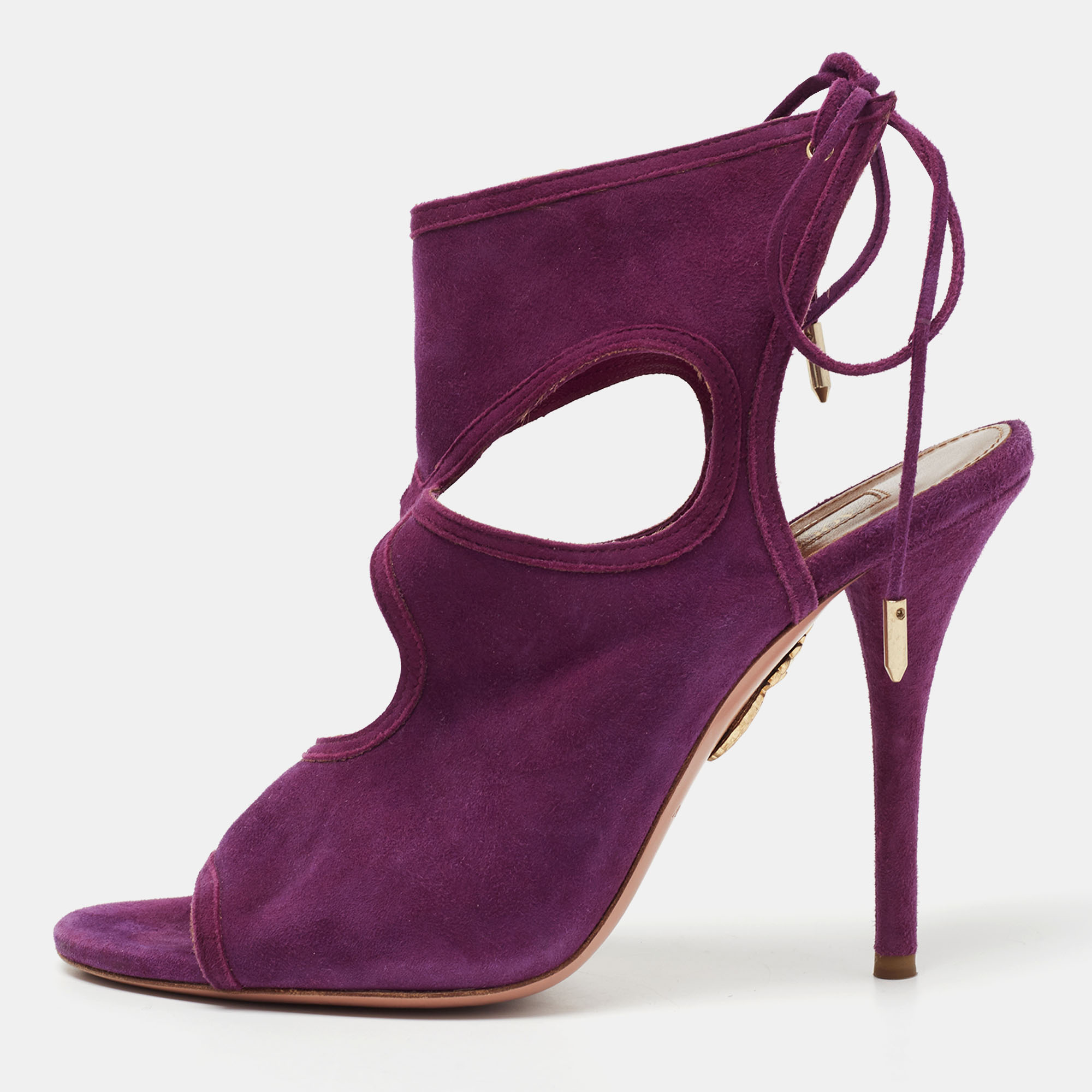 Aquazzura brings forth an amazing style in the form of these sandals that impart a stylish look to your ensemble. Designed from purple suede these sandals with cut out details ties and 10.5 cm heels are the perfect choice to rock a chic look.