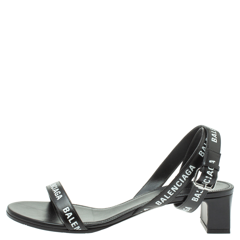 

Balenciaga Black Leather Allover Logo Print Open Toe Ankle Strap Sandals Size