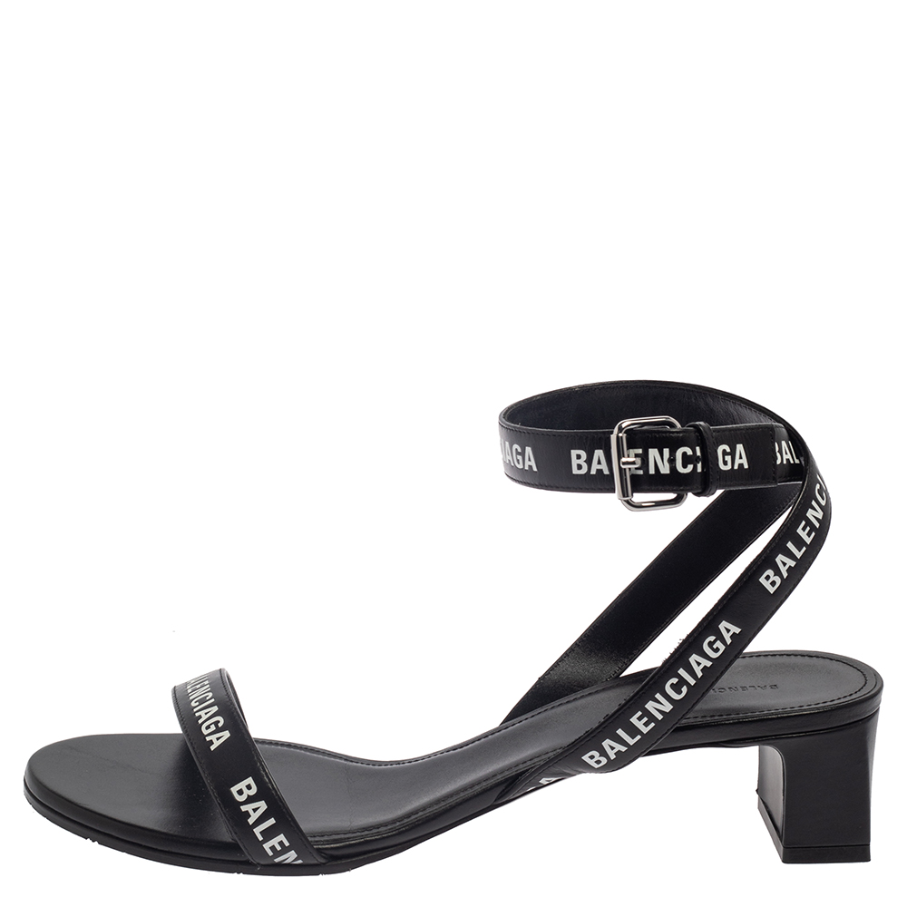 

Balenciaga Black Leather Allover Logo Print Open Toe Ankle Strap Sandals Size