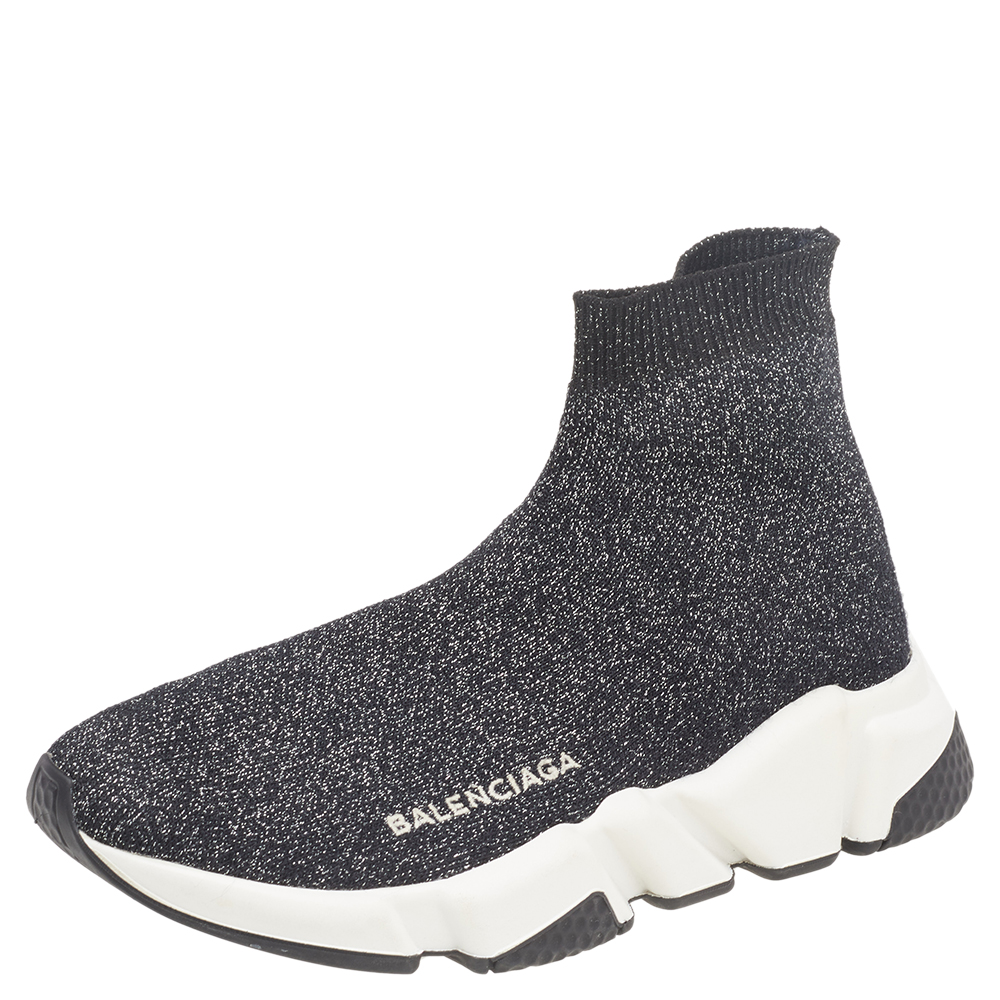 Celebrating the fusion of sports and luxury fashion these Balenciaga Speed Trainer sneakers are absolutely worth the splurge. They are laceless and so well crafted with glitter knit fabric in a sock style. The sneakers are also designed with shock absorption and memory soles to assist you at every step. Fully equipped to give you the best experience this style filled pair deserves to be yours.